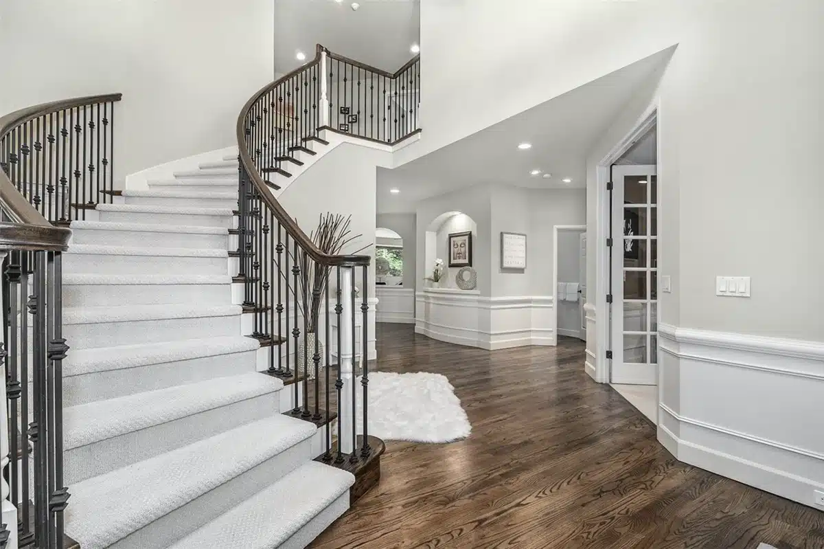 - project image Finished staircase coordinated with refinished hardwood in the Redmond home remodel