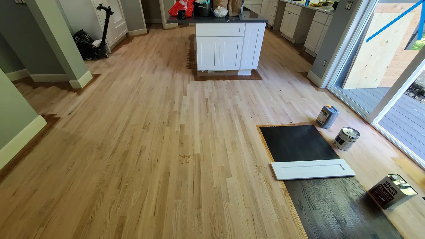 - project image Hardwood floor stain selection progress during the Redmond kitchen remodel