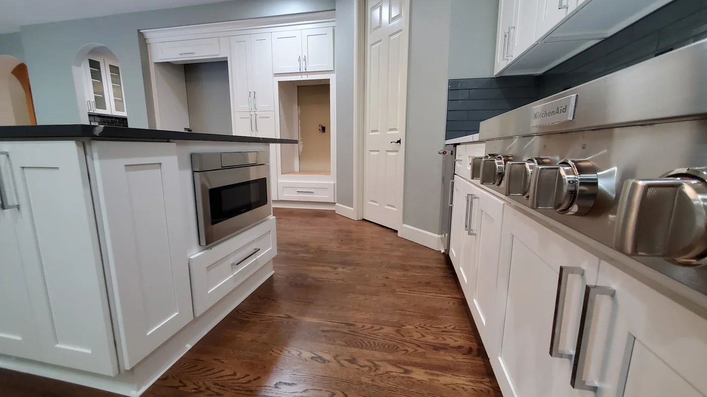 - project image Island cabinet hardware and dark quartz detail in the Redmond kitchen remodel