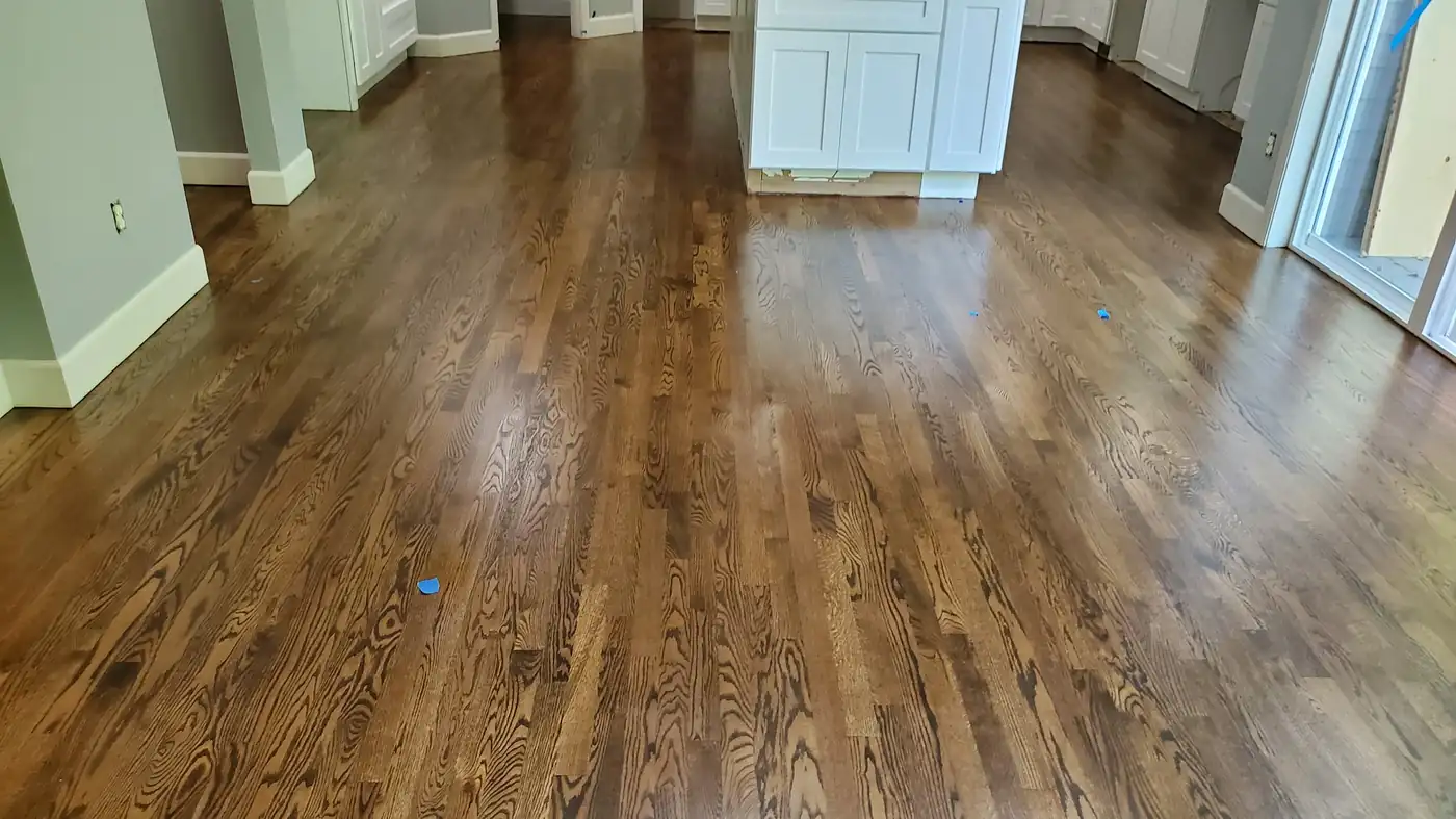 - project image Refinished downstairs hardwood floor beside the completed Redmond kitchen