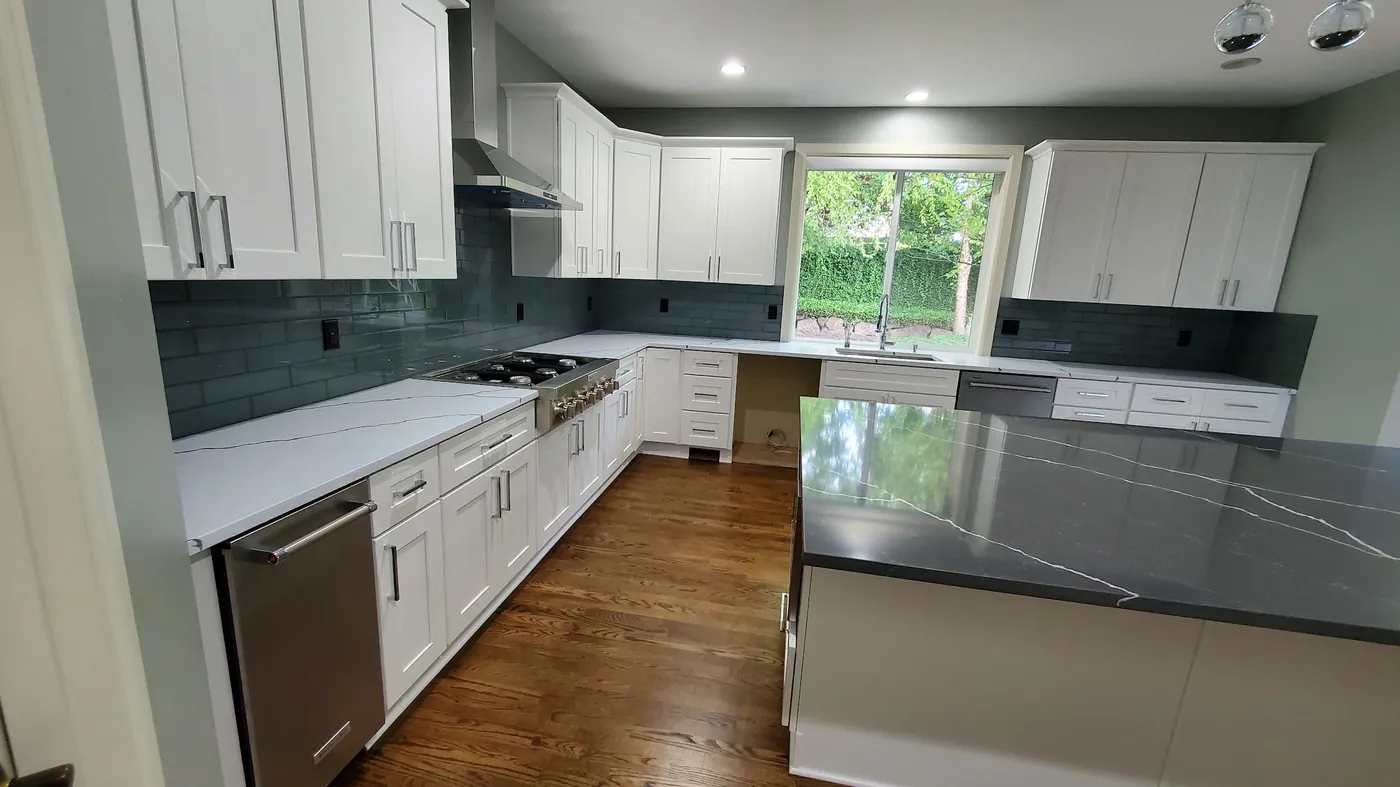 - project image White shaker cabinets along the window wall of the Redmond kitchen