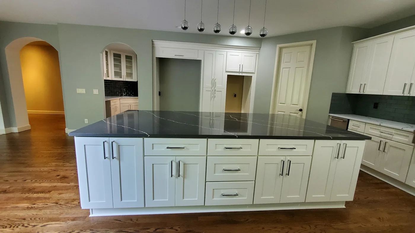 - project image White shaker island and cabinets in the completed Redmond kitchen remodel