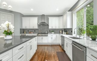 White shaker in wet room, quartz counters and backsplash 3 at kitchen remodel project in Redmond