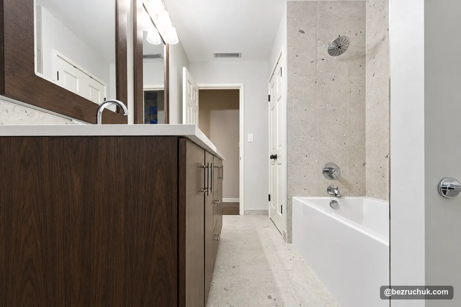 Old house bathroom remodel in Mercer Island with a dark wood vanity, white counter and tiled tub