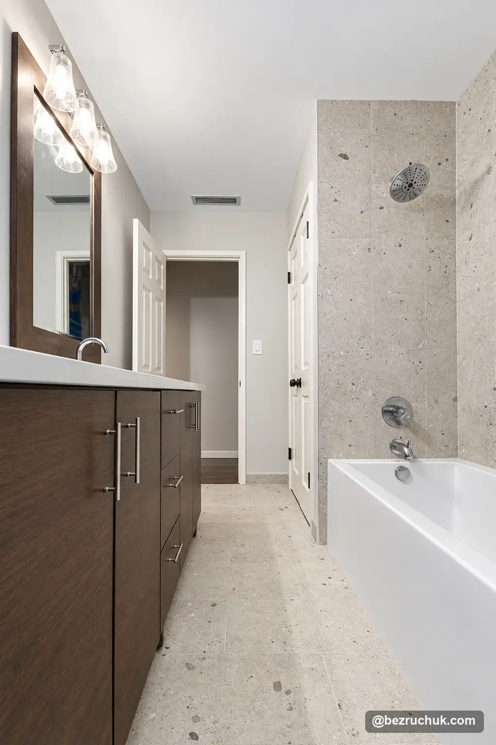 - project image Completed Mercer Island bathroom with dark wood cabinetry opposite a tiled bathtub