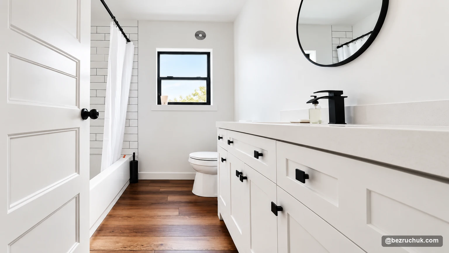 Finished older home bathroom remodel in Puyallup with white vanity, subway tile and black fixtures