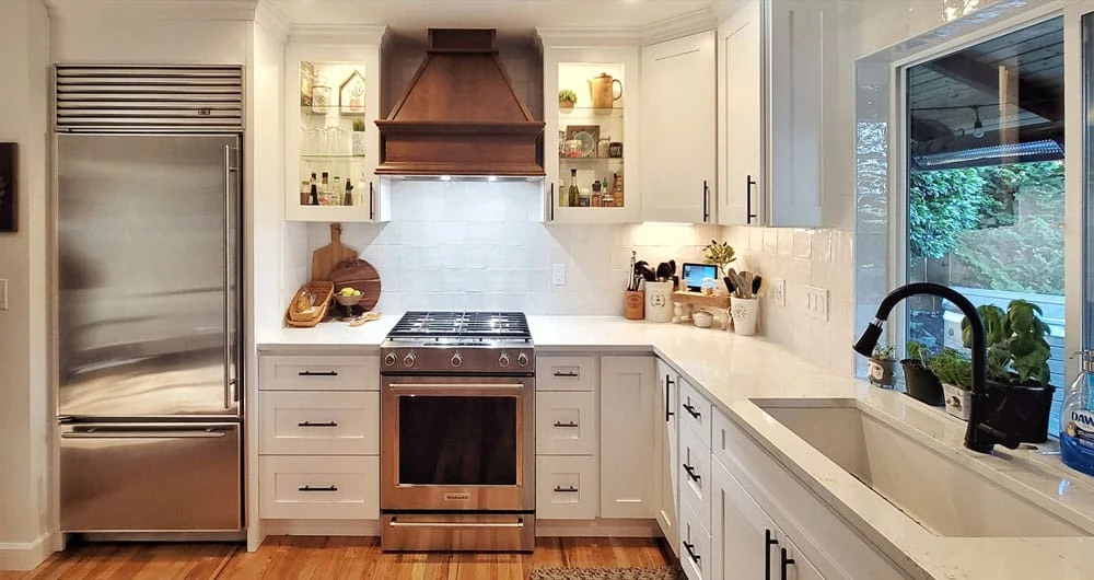 - project image After water damage restoration Puyallup kitchen remodel with white cabinets and tile backsplash