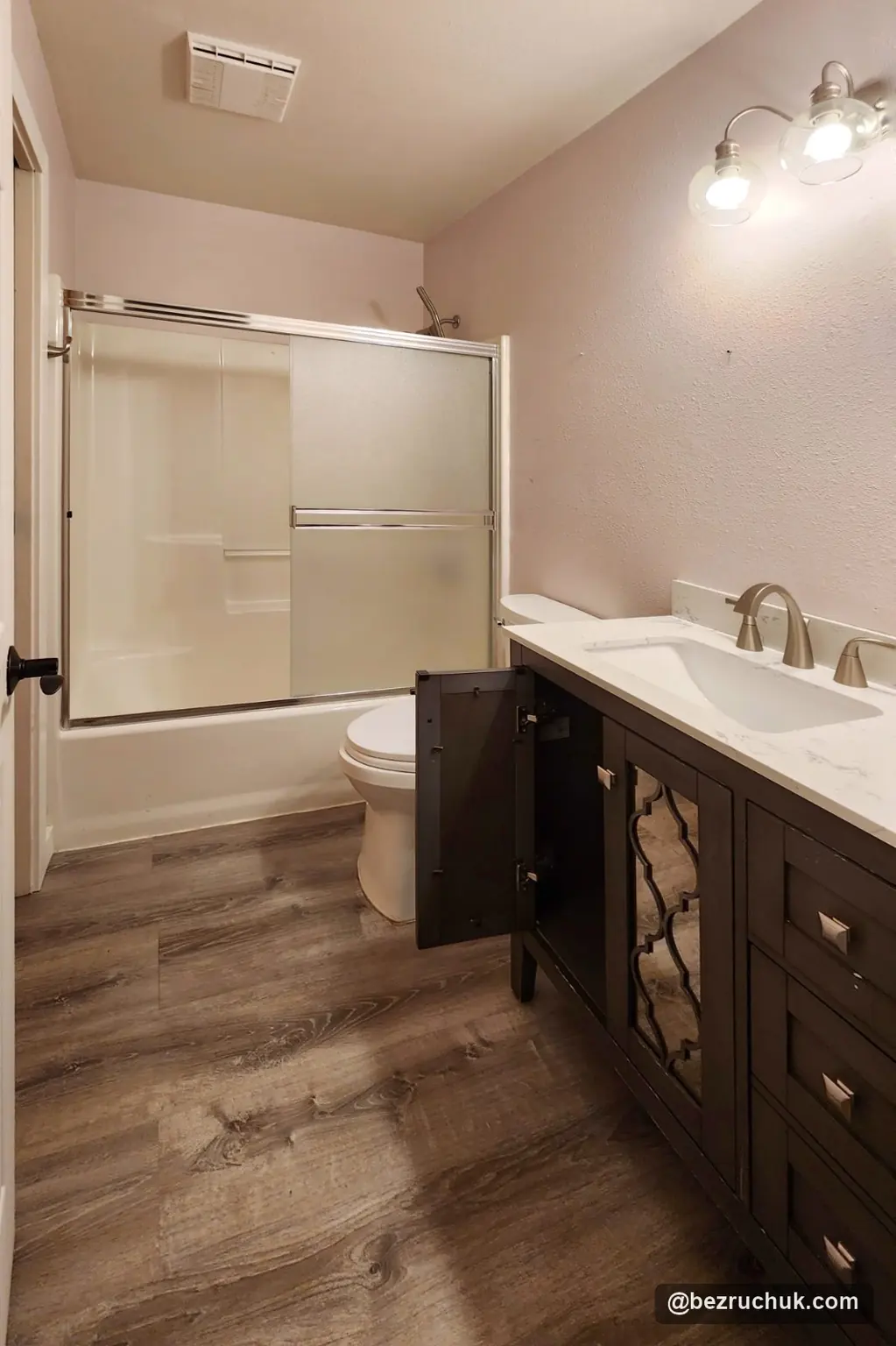 - project image Ames Lake bathroom before remodeling with a tub, framed shower doors and dark vanity