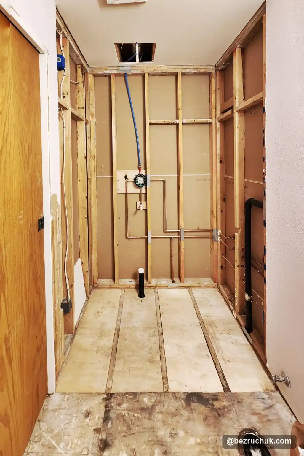 - project image Opened shower framing and lowered floor preparation after removing the old tub