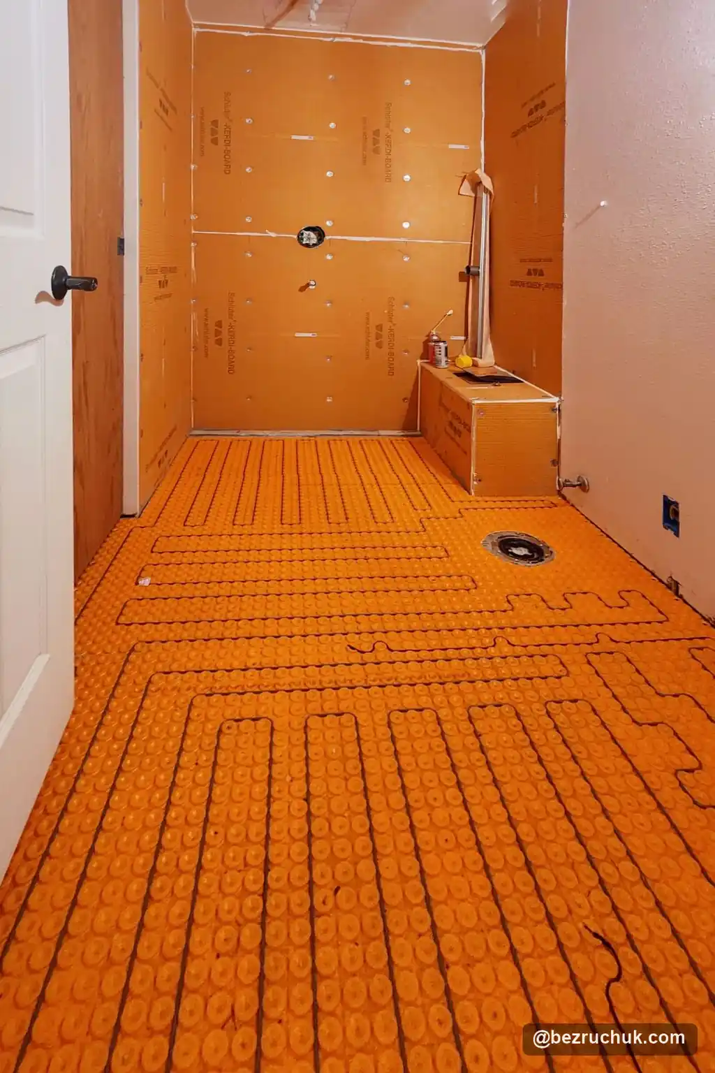 - project image DITRA-HEAT floor membrane and heating cables before tile in the Ames Lake bathroom