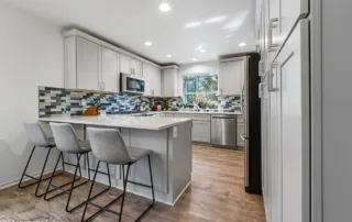 Kitchen remodeling project Graham WA with Shaker cabinets, quartz countertops, and mosaic backsplash.