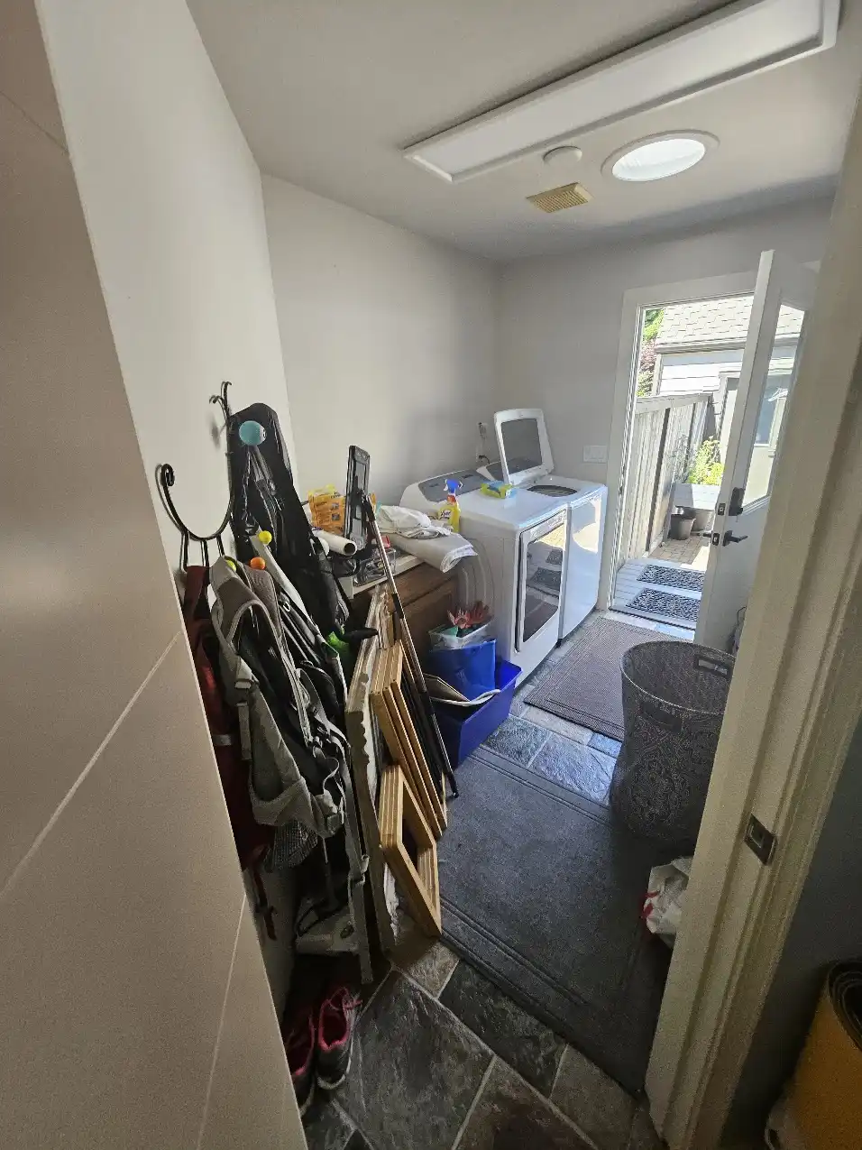 Laundry room area before the connected Bellevue kitchen and main-floor remodel