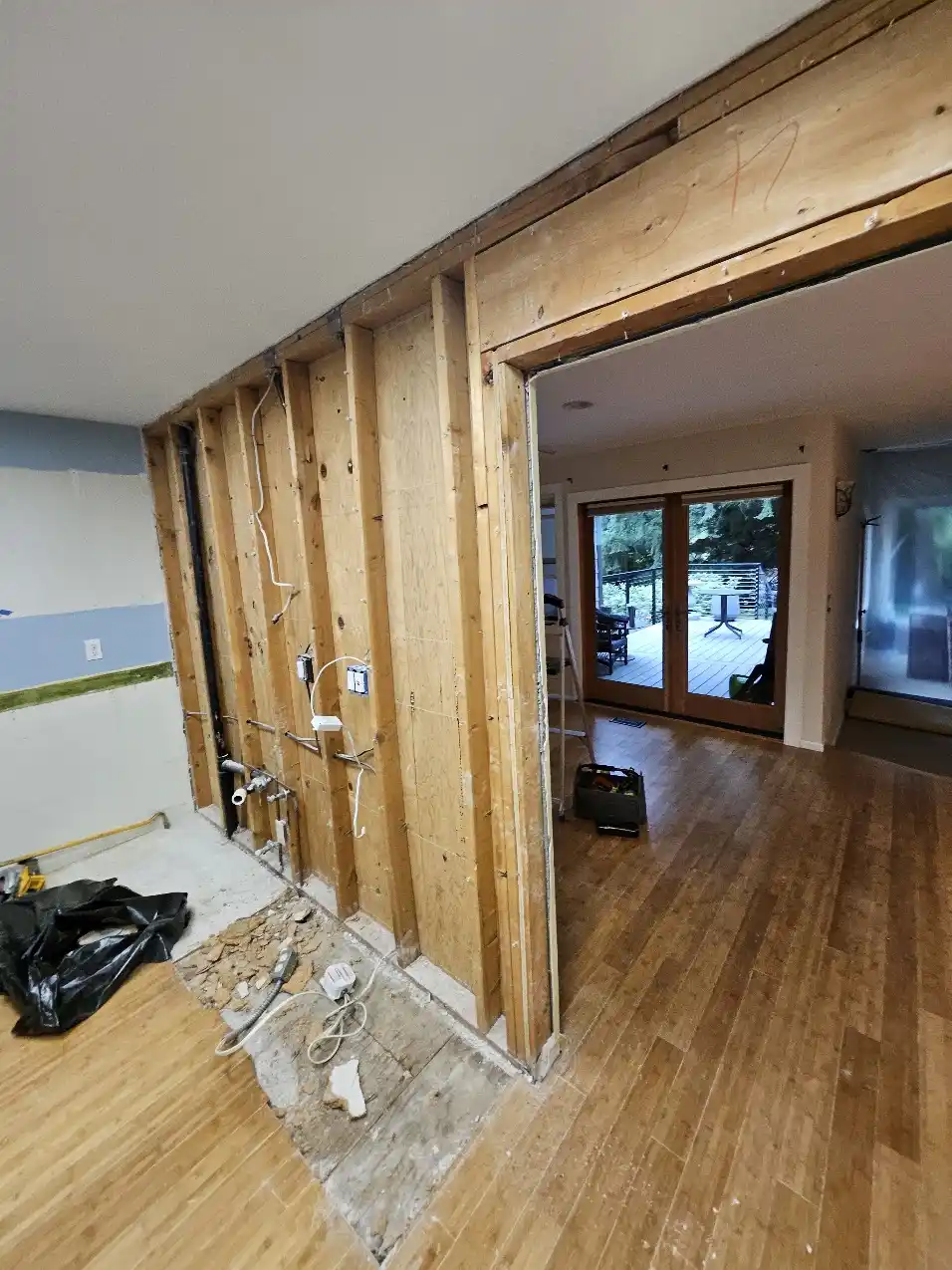 Exposed shear-wall plywood during the Bellevue kitchen remodel