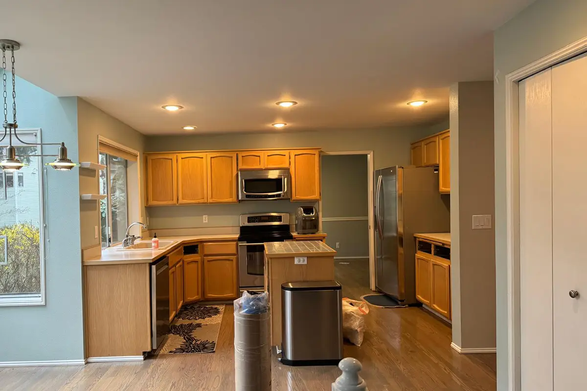 Outdated oak kitchen with laminate countertops and original layout before remodeling in Issaquah, WA