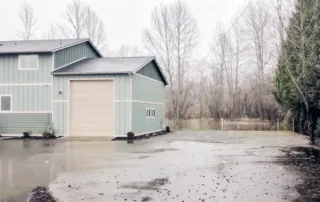 - project image Flooded residential property in Orting Washington after heavy rainfall and rising groundwater