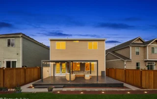 - project image Full home renovation in Puyallup WA featuring a tiled patio, aluminum patio cover, updated exterior paint, and outdoor living space