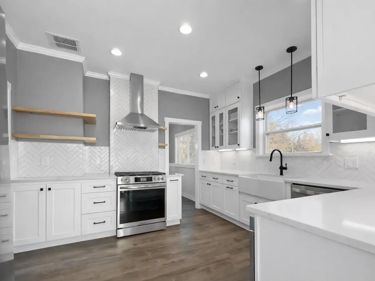 - project image Finished kitchen remodel in Edgewood WA with white shaker cabinets, updated lighting, and improved layout