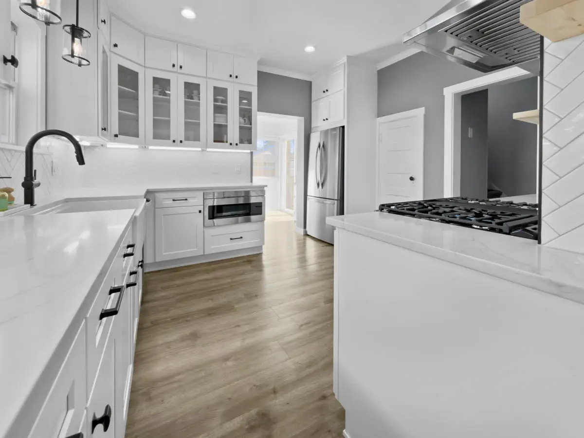 - project image Completed kitchen remodel in Edgewood WA featuring white shaker cabinets and improved layout