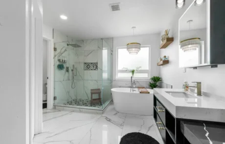 Completed Bathroom Remodel in Puyallup Completed bathroom remodel in Puyallup with glass shower, freestanding tub, custom vanity, and marble-look tile