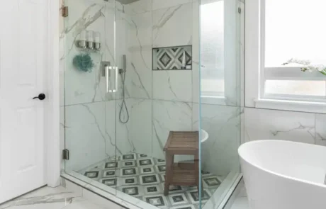 Frameless Glass Shower in Puyallup Bathroom Remodel Frameless glass shower with patterned tile floor in a Puyallup bathroom remodel