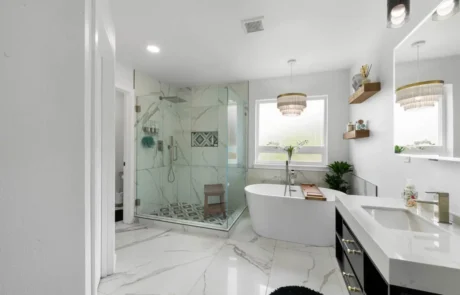 Completed Bathroom Remodel in Puyallup Completed bathroom remodel in Puyallup featuring freestanding tub, glass shower, and modern tile flooring