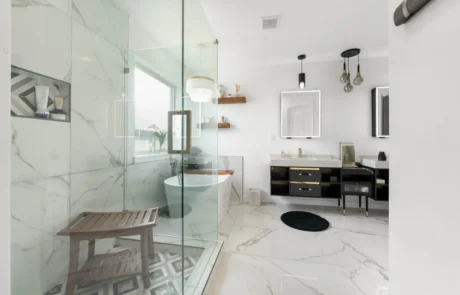 glass-shower-to-vanity-transition Glass shower enclosure transitioning into custom vanity and open bathroom layout