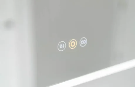 LED mirror touch control detail Touch controls on LED bathroom mirror with lighting and defog features