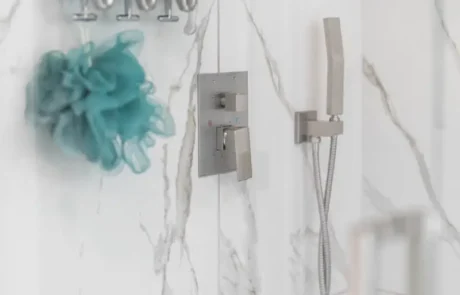 Schluter Shower System in Puyallup Bathroom Remodel Schluter waterproofed shower in Puyallup with modern fixtures, marble-look tile, and glass enclosure