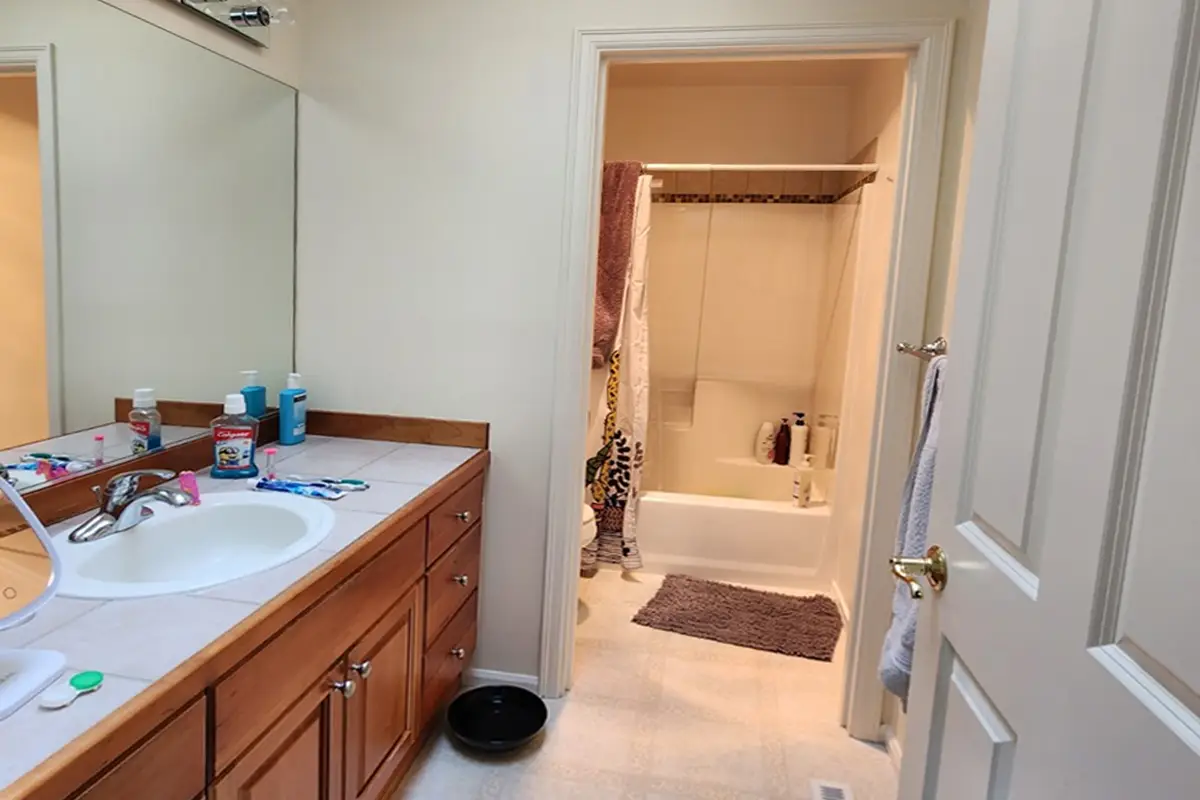 Guest bathroom before remodel in Puyallup with dated vanity and bathtub