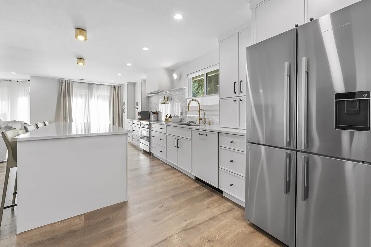kitchen remodeling North Canton modern white kitchen with island and stainless appliances