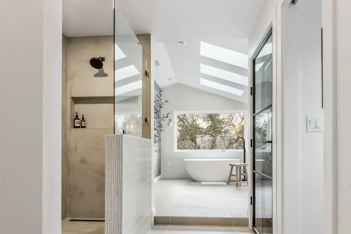 bathroom addition in North Canton Ohio with modern walk in shower skylights and freestanding tub