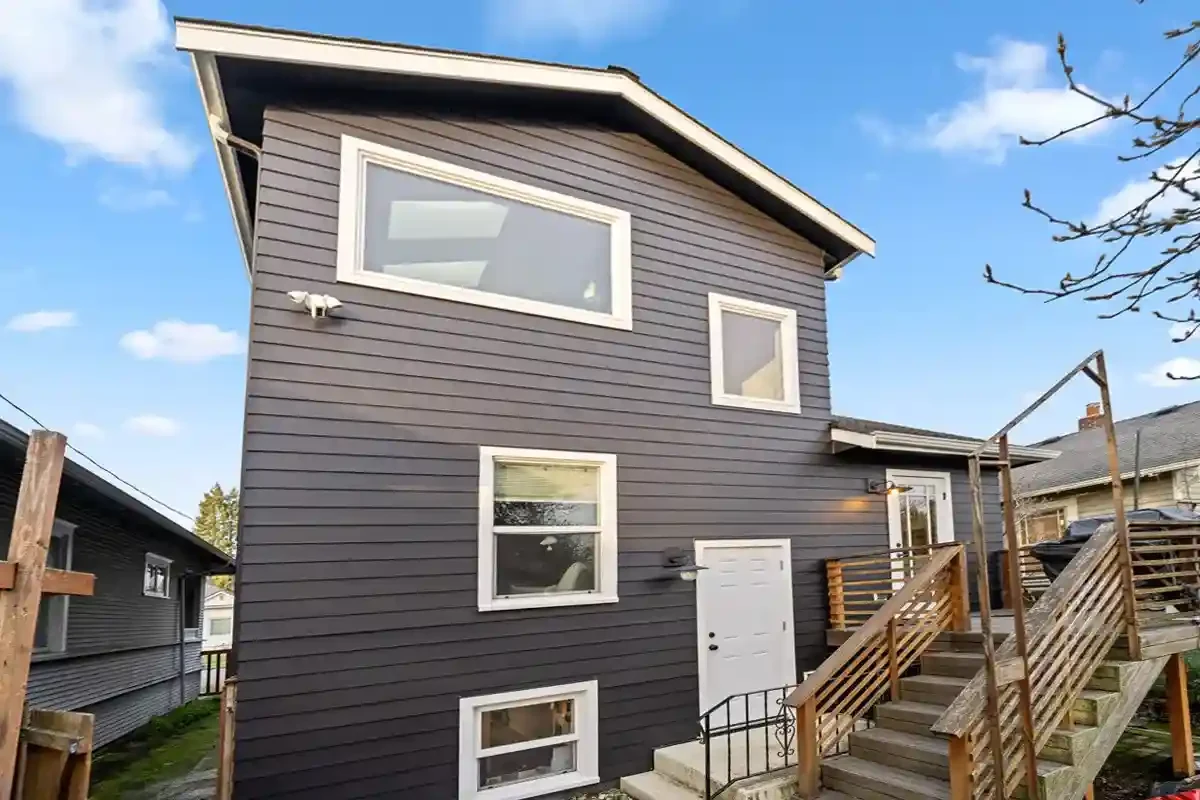 - project image Finished whole-home renovation example with updated exterior, porch, and clean residential curb appeal