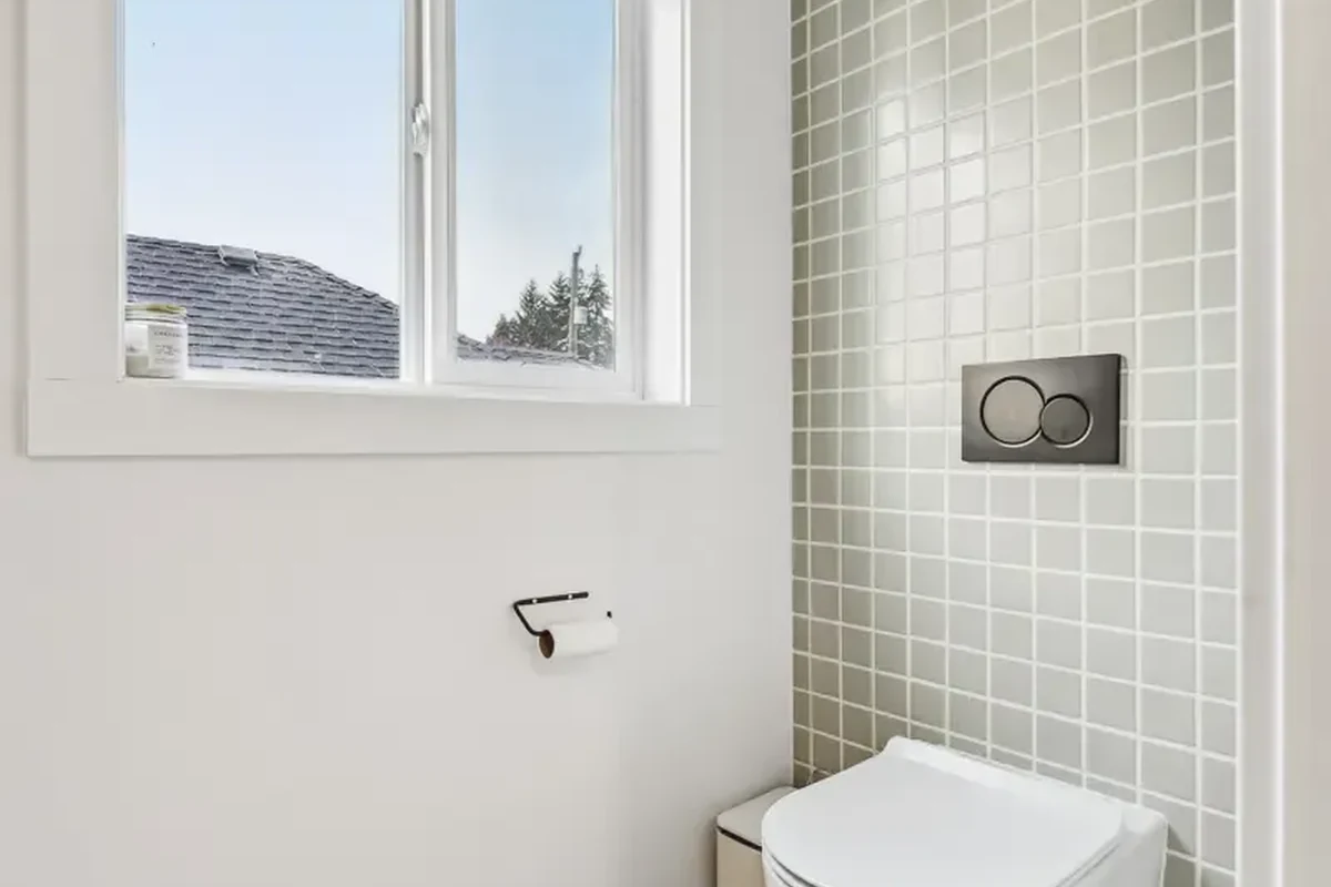 Akron Home Renovation Bathroom Wall Tile Example Bathroom wall tile renovation example with toilet area, patterned tile, and clean modern finishes