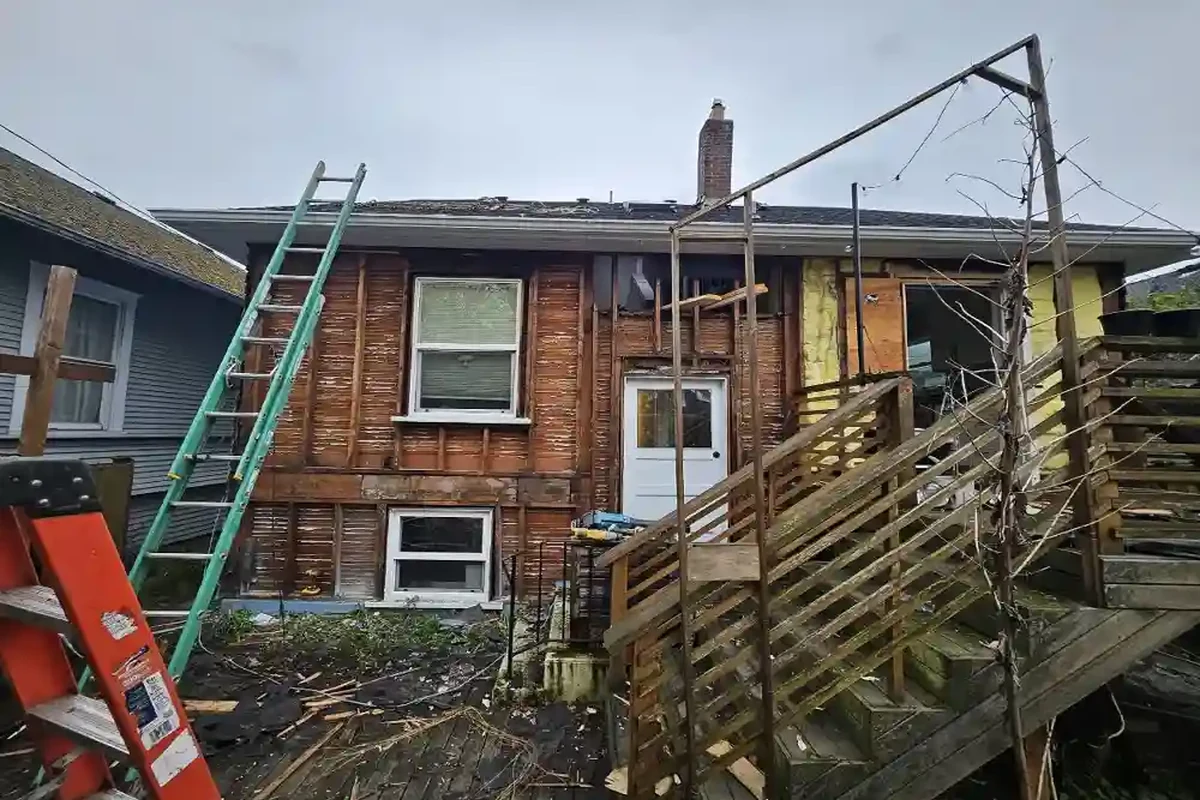 - project image Before photo example of an older home exterior prior to a larger renovation project