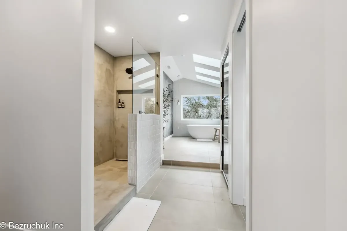 Akron Home Renovation Finished Bathroom Addition Example Finished bathroom addition example with white fixtures, tile flooring, and clean painted walls