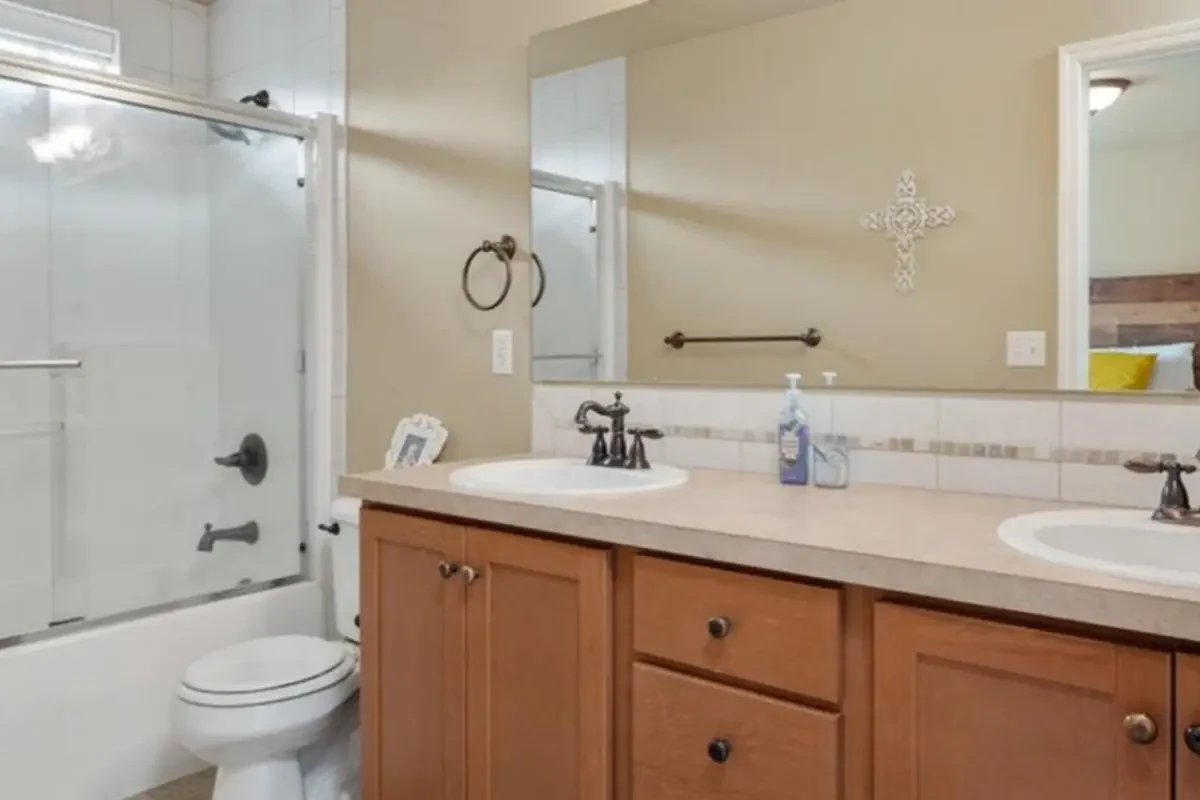 - project image Before photo example of a master bathroom before a full bathroom renovation