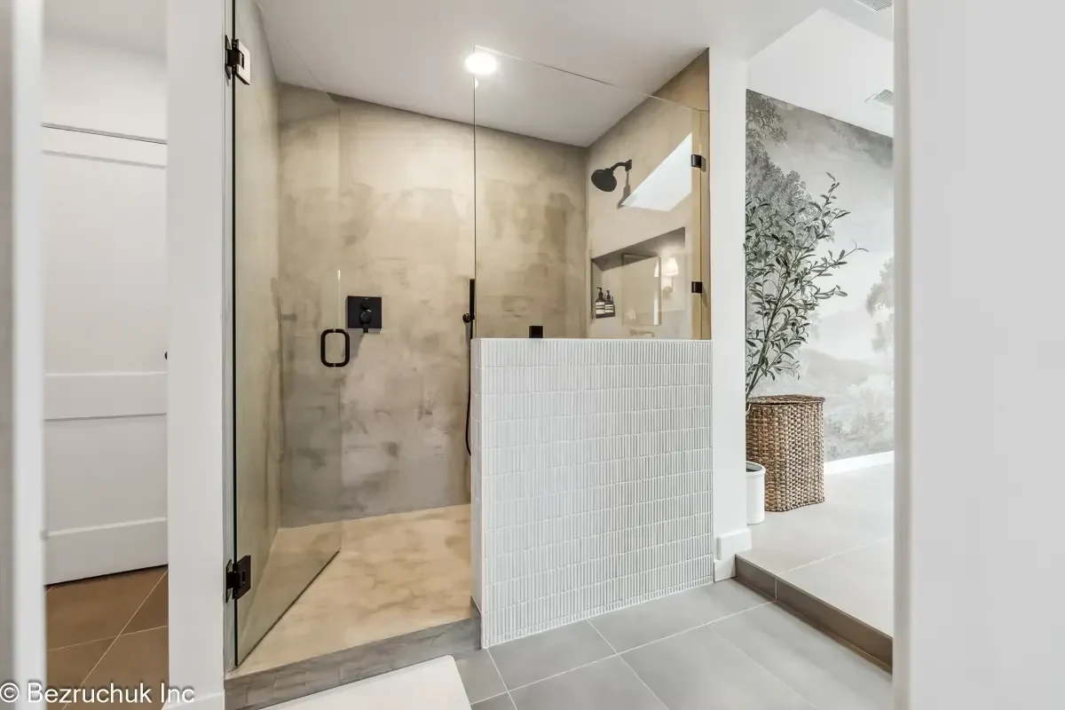 Akron Home Renovation Microcement Shower Example Alt text: Bathroom shower renovation example with microcement finish, glass door, and modern waterproof shower design