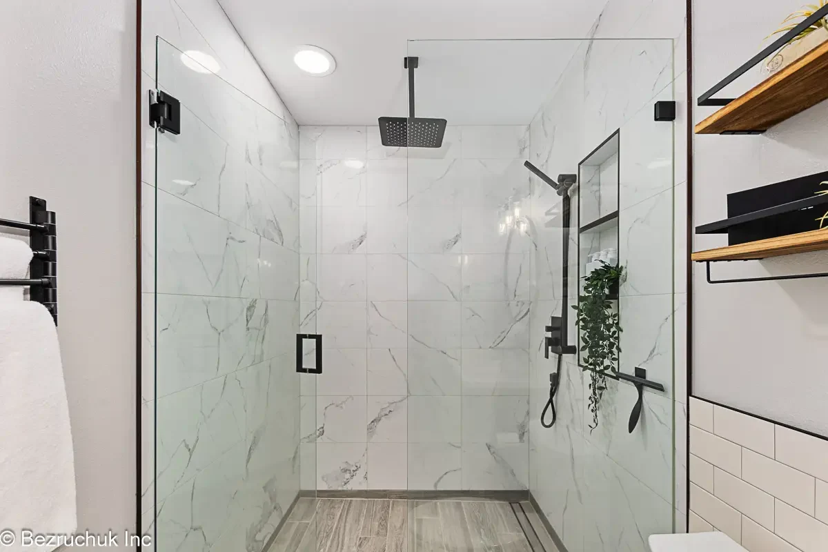 Akron Home Renovation Walk-In Shower Example Bathroom renovation example with walk-in shower, glass door, tile walls, and built-in shower niche