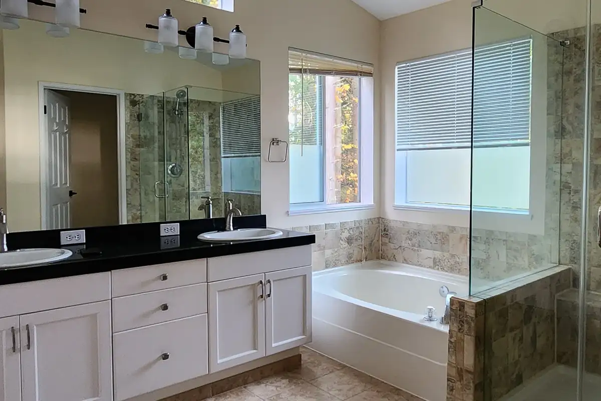 Before photo of Akron bathroom remodel with original vanity and tub area