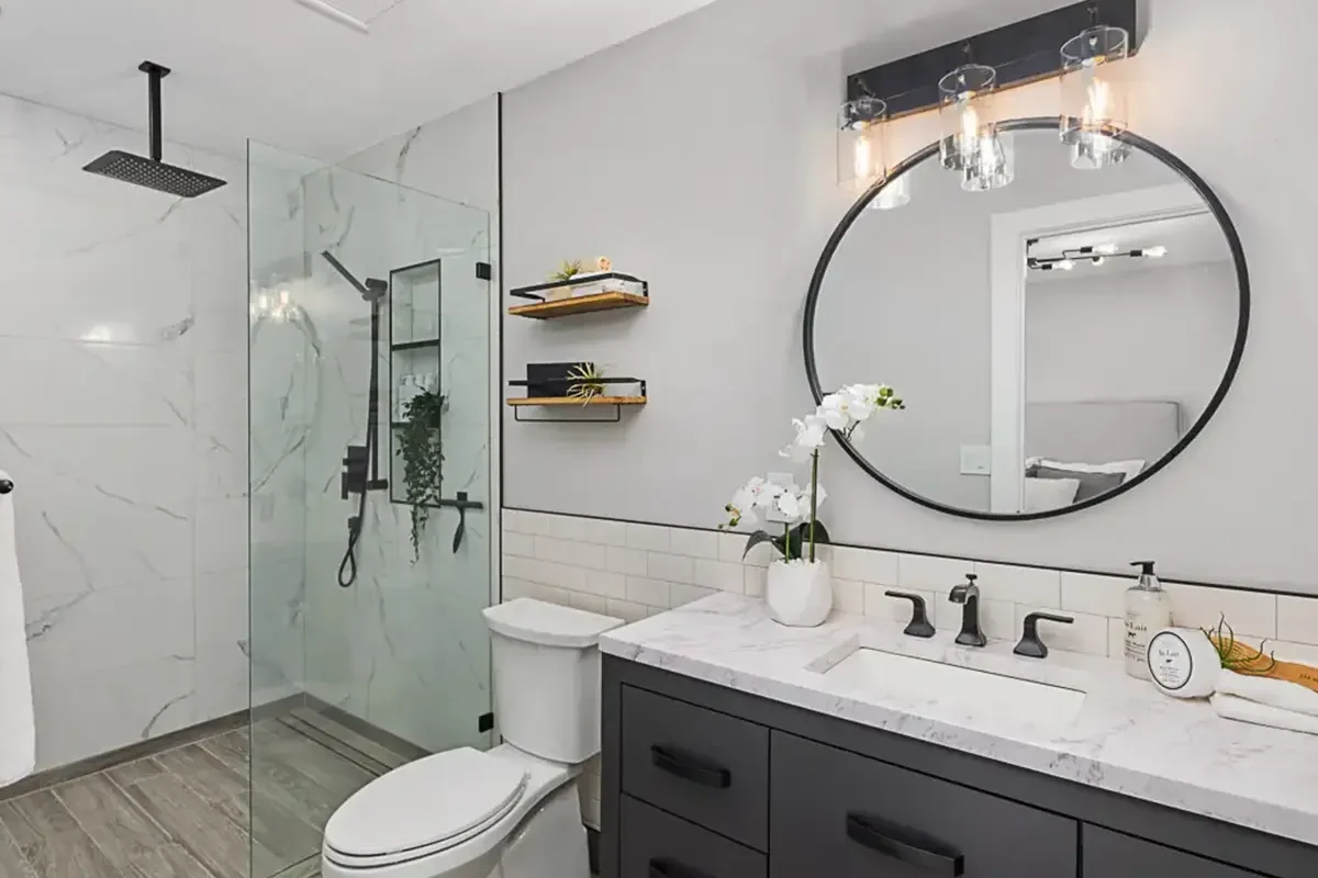 Finished master bathroom renovation example with walk-in shower, freestanding tub, and modern finishes