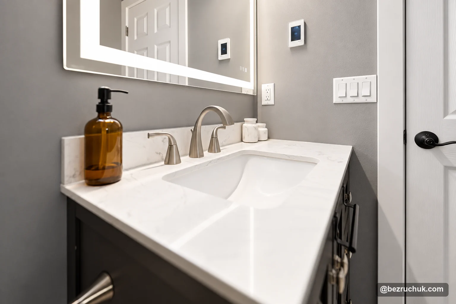 - project image Rectangular vanity sink with a three-piece faucet and illuminated mirror