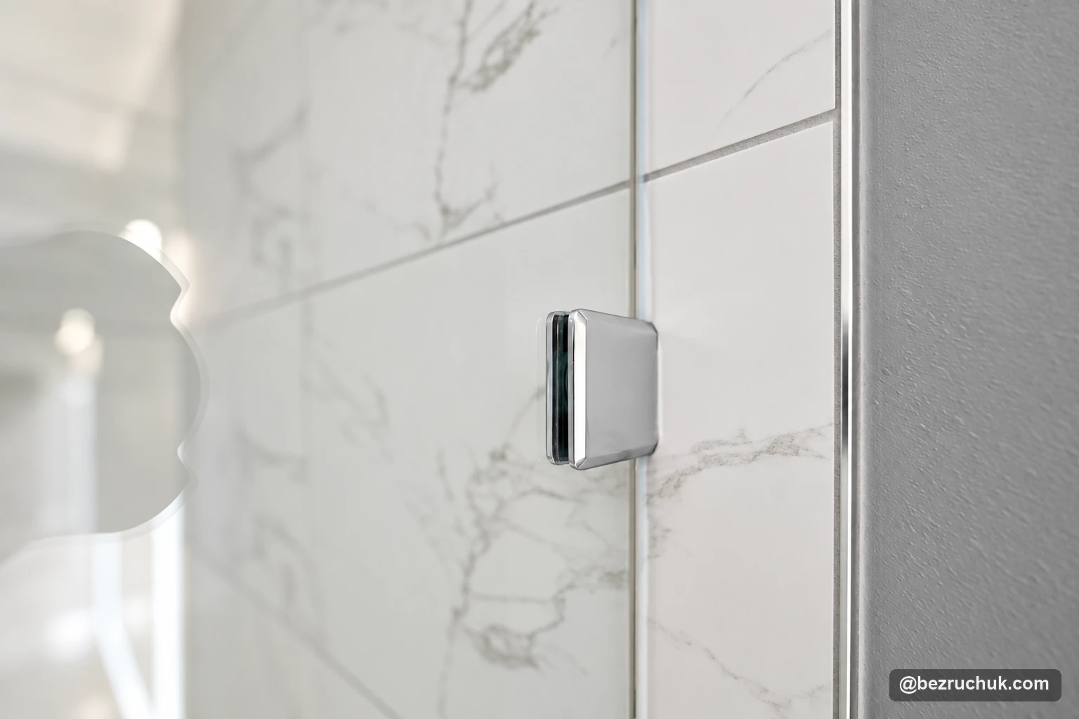 - project image Frameless shower glass attachment clip against veined porcelain wall tile