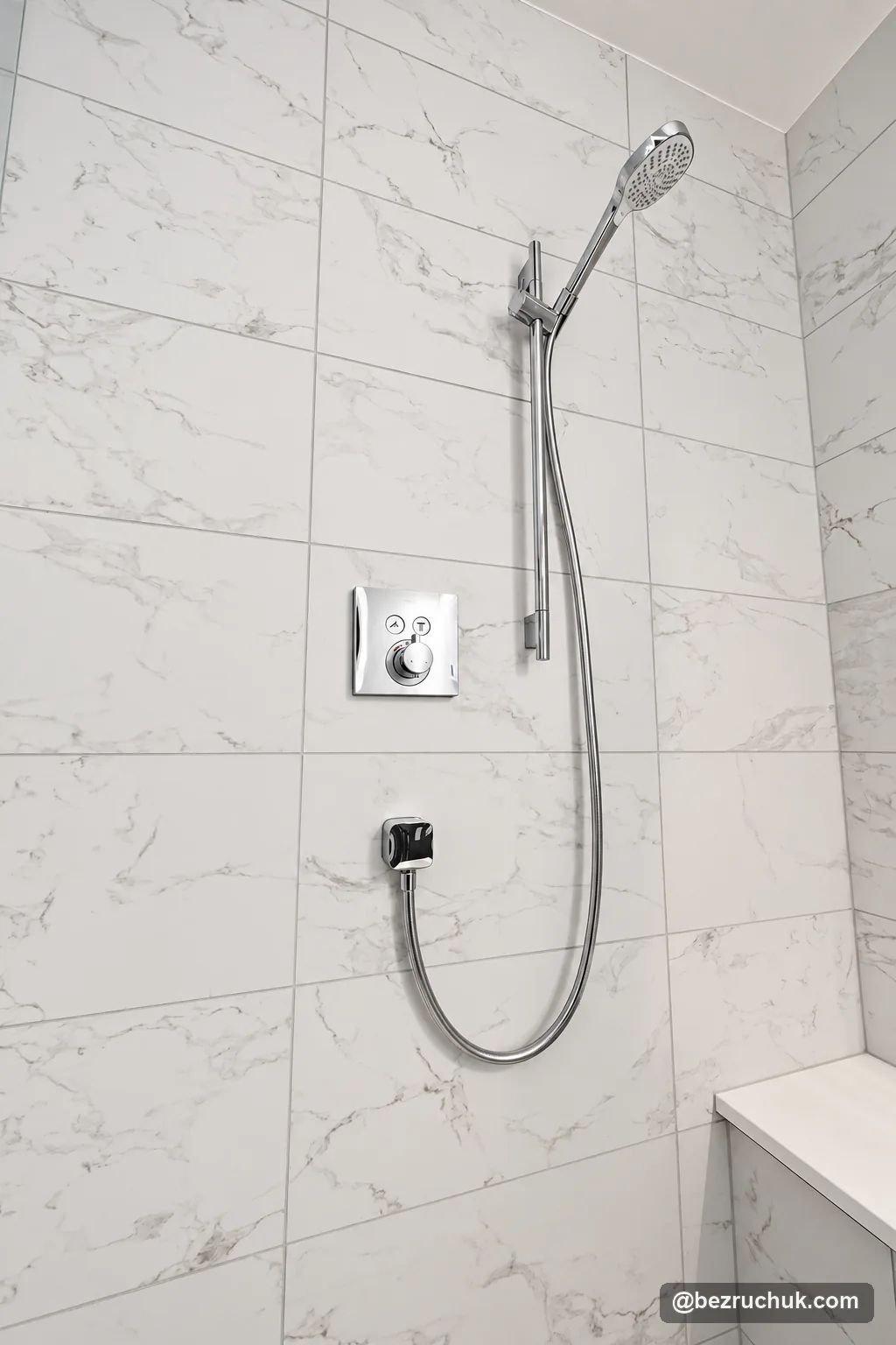- project image Handheld shower, sliding rail, hose and wall control in the finished shower