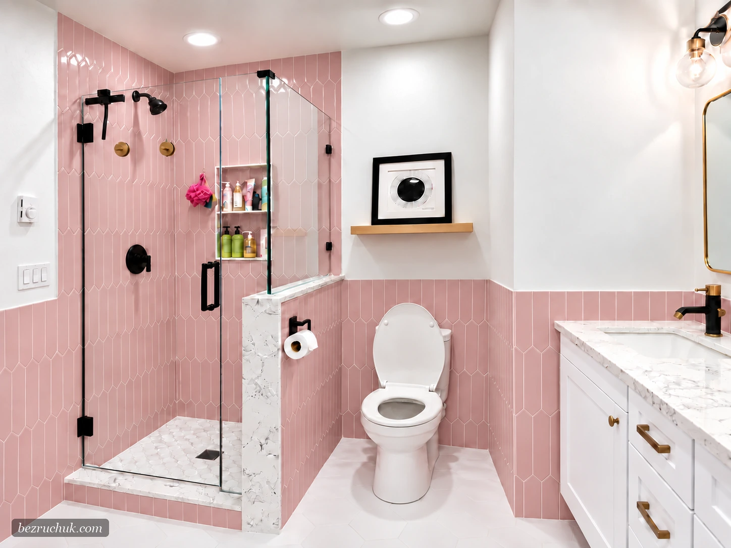 Pink bathroom design with dusty-pink tile walk-in shower, frameless glass, black fixtures, and white vanity