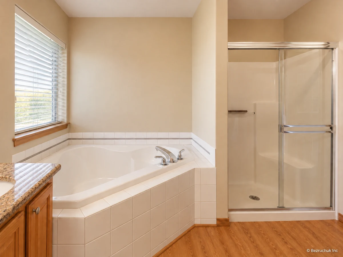 Combined before view from two original bathroom photographs showing built-in tiled tub and framed shower