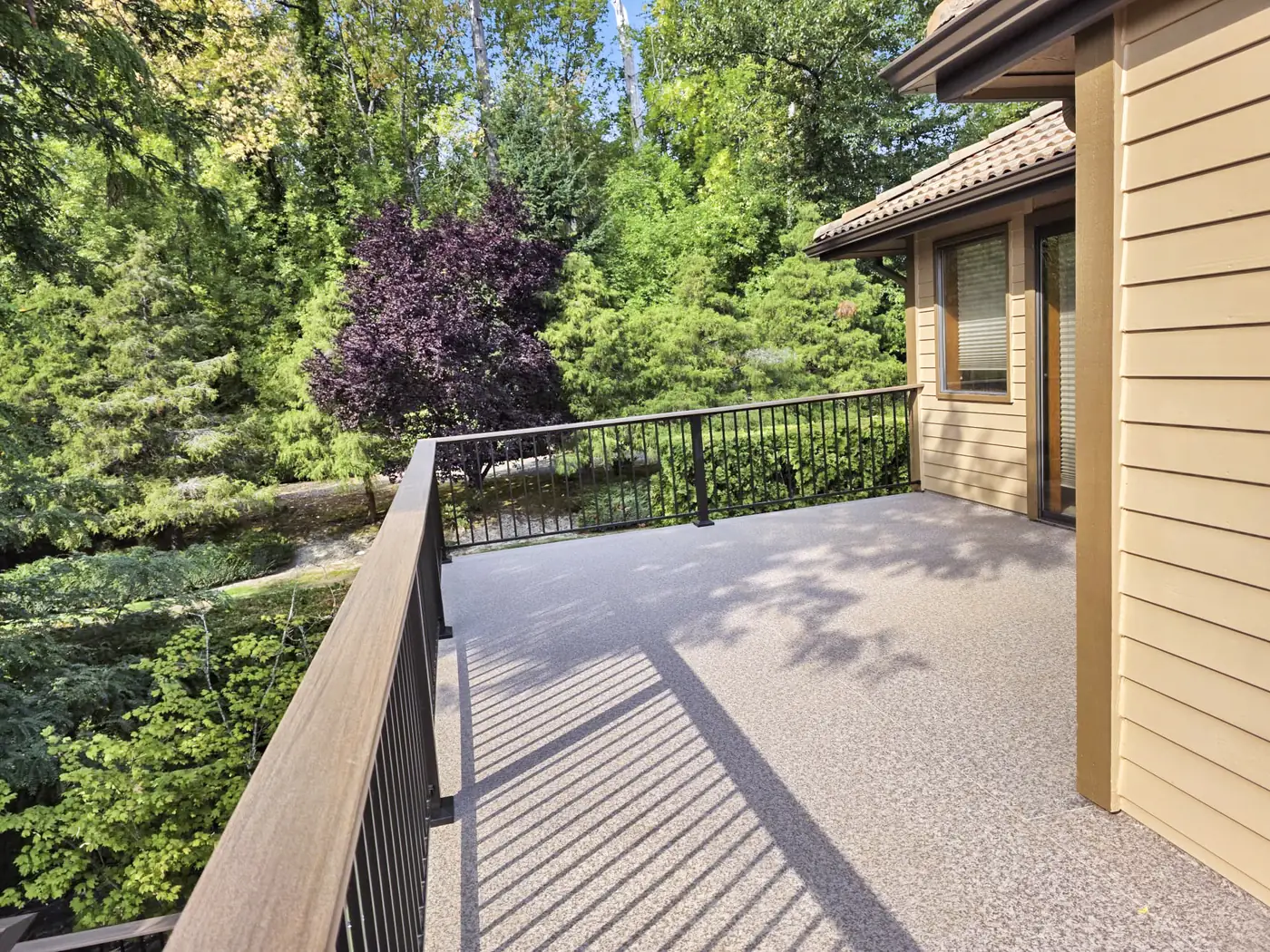 - project image The finished upper balcony surface and railing.