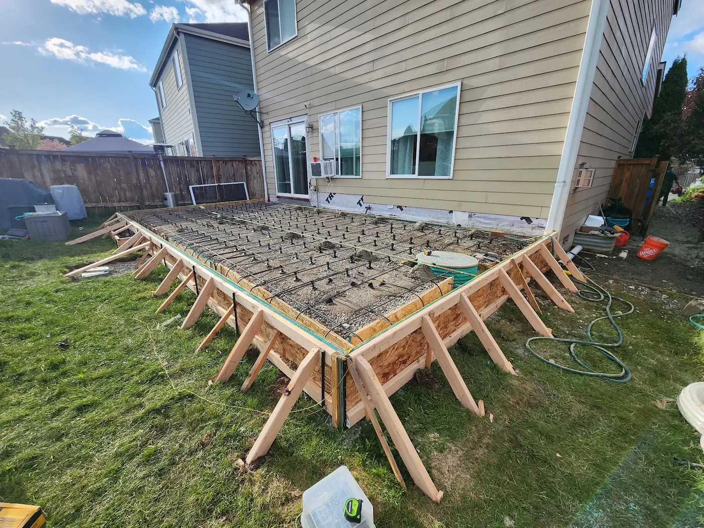 - project image Timber forms and steel reinforcement over a gravel base before the deck concrete pour.