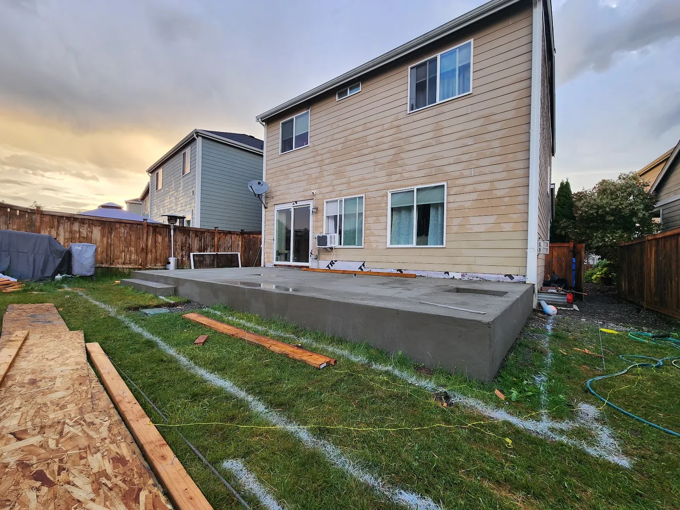 - project image New concrete platform and steps at the back of the Lipoma Firs home before tile and slate finishes.